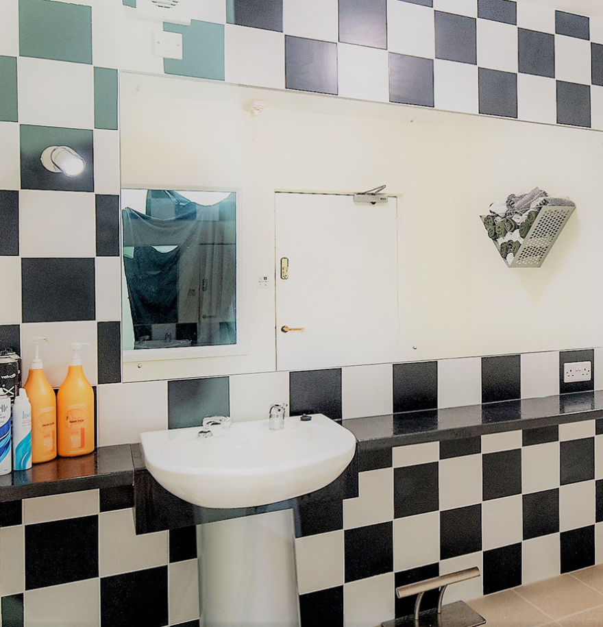 bathroom with black and white checkerboard tiles