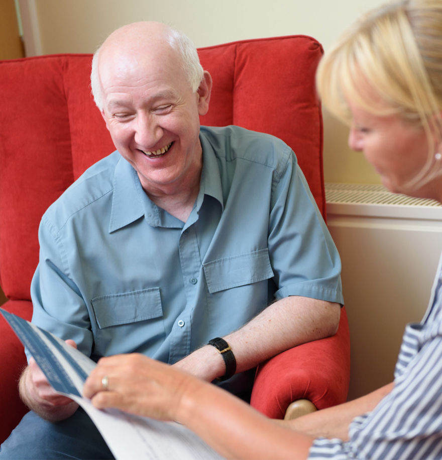 team member and family member looking through brochure